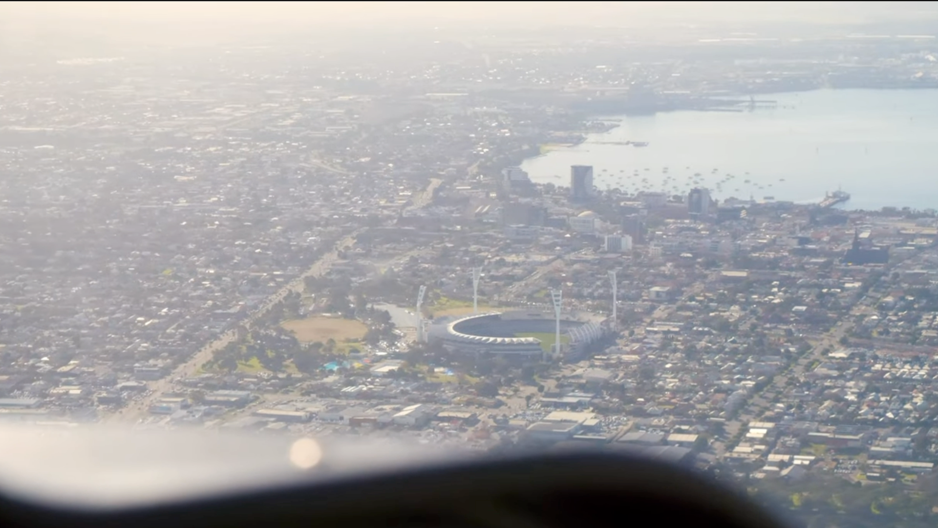 Aerial view of GMHBA stadium surrounded by urban landscape