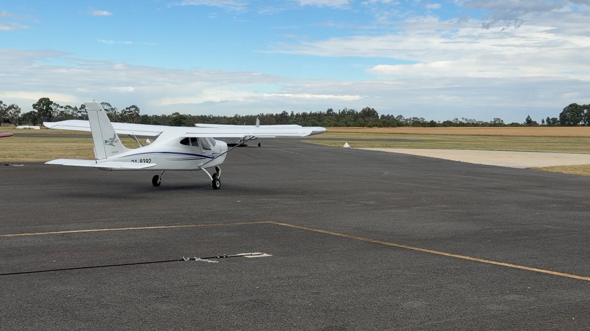 Small airplane on a runway with a clear sky